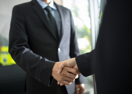 Business handshake and business peopleの写真素材