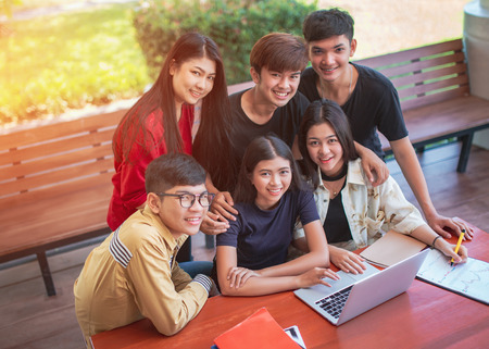 Back to school education knowledge college university concept, Young people being used computer and tablet, Education and technology concept.の写真素材