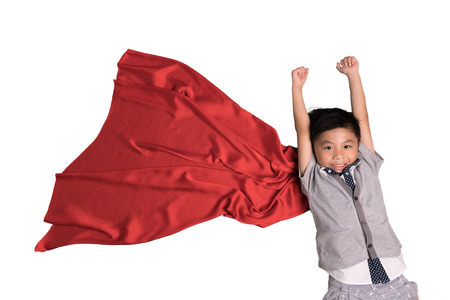 Flying superhero in studio, Child pretend to be superhero, Super hero kid, Success, Creative and imagination conceptの写真素材