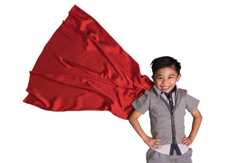 Flying superhero in studio, Child pretend to be superhero, Super hero kid, Success, Creative and imagination conceptの写真素材