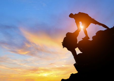 Asia couple hiking help each other silhouette in mountains with sunlight, Couple hiking help each other silhouette in mountains with sunlightの写真素材