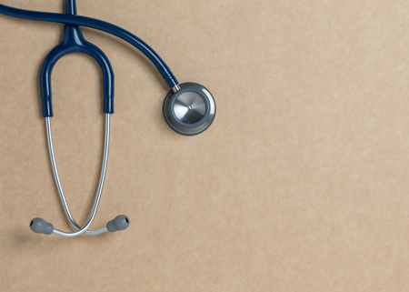 Top view blue stethoscope on yellow background. For check heart or health check up conceptの写真素材