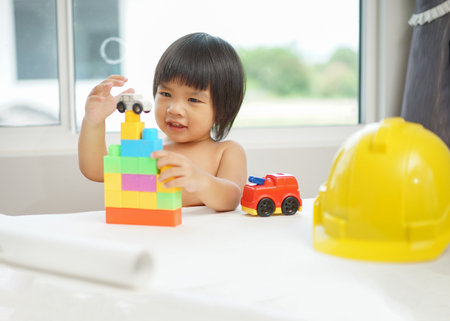 Kids Play Room, Child playing building blocks toys, Development and construction conceptの写真素材