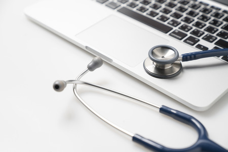 Stethoscope on laptop, Healthcare and medicine or computer antivirus protection and repair maintenance service conceptの写真素材
