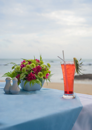 Cocktail with blur beach on background, Cocktail dinner in the sunsetの写真素材