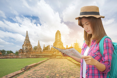 Traveler women with backpack walking in temple Ayuttaya, Thailand, Select focusの写真素材