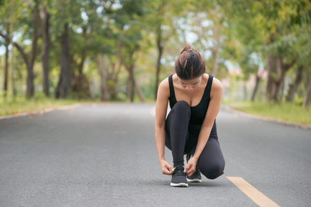 Running shoes, Barefoot running shoes closeup, Runner trying running shoes getting ready for run. Healthy lifestyleの写真素材