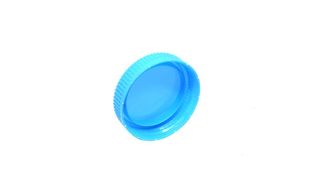 Blue Plastic bottle caps isolated a white background.の写真素材