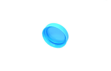 Blue Plastic bottle caps isolated a white background.の写真素材