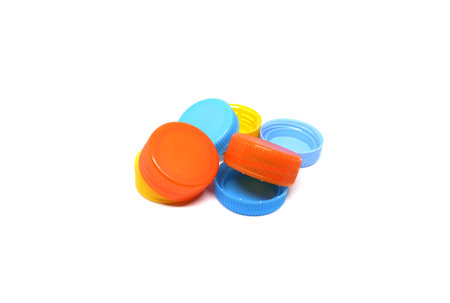 Colorful plastic bottle cap isolated on white backgroundの写真素材