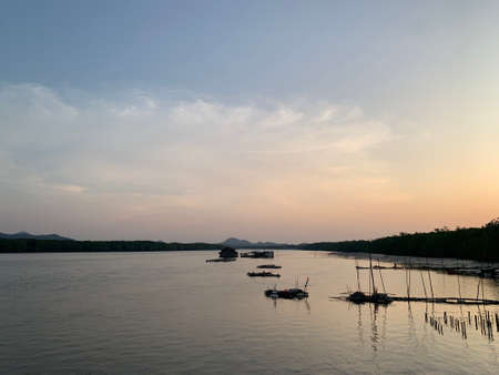 Fishing boats on the Mekong River at sunset, Vietnam.