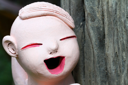 Statue of a smiling child close upの写真素材