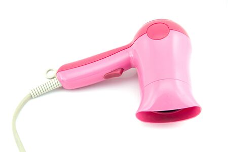 Pink Hair dryer isolated on white backgroundの写真素材