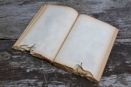 Old book on wood backgroundの写真素材
