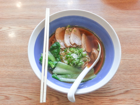 Duck Noodle Soup In a bowl on wood table