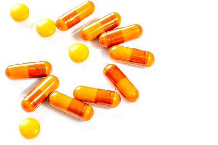 Vitamine capsules on a white background