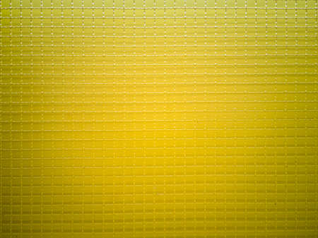 Straight angle photos, Crimped wire mesh, seamless abstract pattern, yellow square eyes, lined up, yellow background and shadows, endless patterns can be used on building walls, fences, railings,の写真素材
