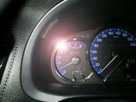 Eye-level angle, close-up, temperature car symbol, and white lens flare, black console floor,...