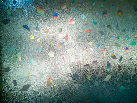 Close-up, frosted glass, artistic motifs and black shadow.