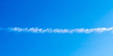 Sky background pattern with partially cloudy. White clouds or smoke in the sky, cigar shapeの写真素材