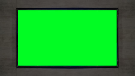 green widescreen tv is mounted on the dark cement wallの写真素材