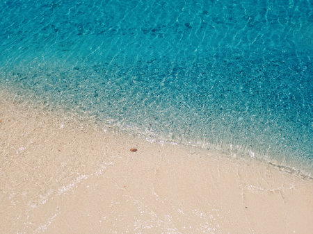 Clear blue sea and sandy beach on a bright and sunny day. Beautiful nature scenery for a holiday...