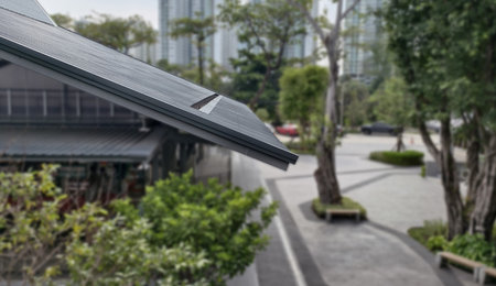 Low-angle, eye-level shot modern sloped roof with textured panels and streamlined design. background...