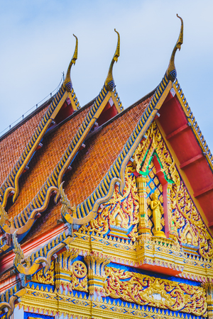 The beautiful golden church and  the blue sky in Thailand.の写真素材