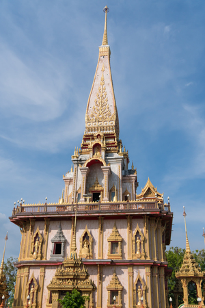 The ancient gold and white pagodas are dominated by the blue sky.の写真素材