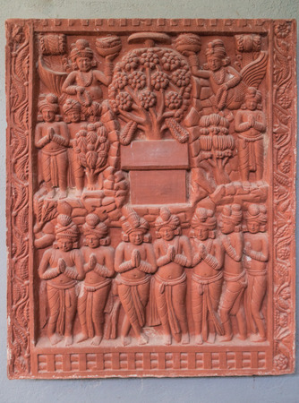 Many Buddha images together, chanting as an antique on the wallのeditorial素材
