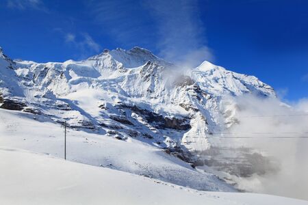 Alpine Alps mountain landscape at Jungfraujoch, Top of Europe Switzerlandの写真素材