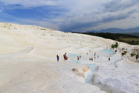 PAMUKKALE, TURKEY - APRIL, 16  Tourists on Pamukkale travertines on April 16, 2014 in Pamukkale, Turkey  Pamukkale,  nowadays become one of the most visited sight in Turkey のeditorial素材