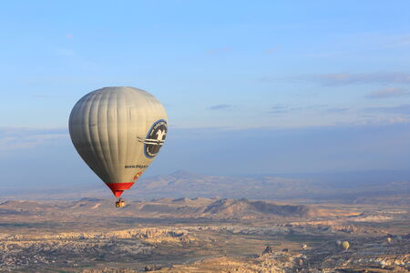 GOREME, TURKEY - APRIL, 14: Hot air balloon fly over Cappadocia on April 14, 2014 in Goreme, Cappadocia, Turkeyのeditorial素材