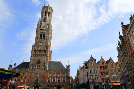 BRUGES, BELGIUM - APRIL 16: Market square in Bruges on April 16, 2015. Bruges is the capital and largest city of the province of West Flanders in the Flemish Region of Belgium.のeditorial素材