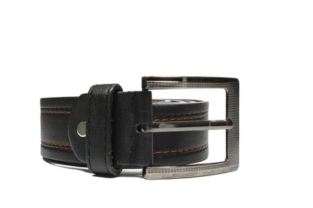 belt brown leather  twisted into a ring in white backgroundの写真素材