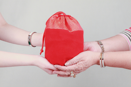 Giving gift from hand to handの写真素材