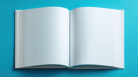 A blank, open book on a vibrant blue background, offering a unique platform for creative ideas, writing, or branding without distractions. Ideal for educational themes.の素材