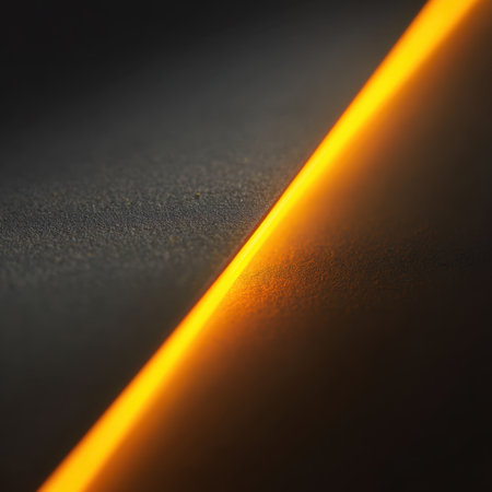 A captivating image featuring a glowing orange diagonal line against a dark surface, creating a striking contrast that adds warmth and elegance to any artistic project.の素材