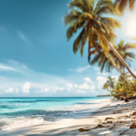 Discover a tranquil tropical beach where crystal-clear water meets soft sand, surrounded by lush palm trees under a bright blue sky. Perfect for vacation inspiration.の素材