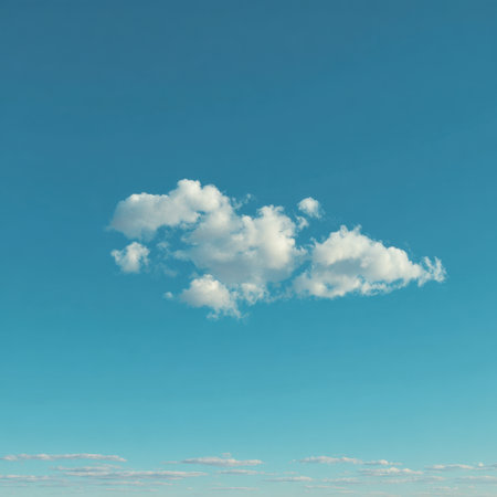 A beautiful image of soft white clouds gracefully floating in a clear blue sky, capturing a sense of calm and peace, ideal for backgrounds and nature-themed projects.の素材
