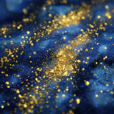 Stunning abstract image featuring gold particles against a deep blue background, perfect for artistic projects, branding, or decorative uses.の素材