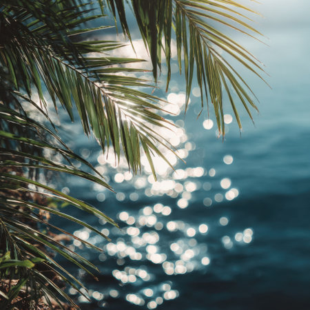 A serene tropical scene showcasing lush green palm leaves above a shimmering water surface, creating a perfect atmosphere for relaxation and escape into nature's beauty.の素材