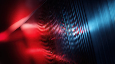 Vivid abstract design showcasing light reflections on a textured metallic surface in red and blue, creating a captivating atmosphere perfect for modern artistic projects.の素材