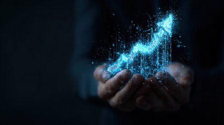 A businessman holds a glowing digital graph that represents growth and success, combining elements of technology and finance in a visually striking abstract display.の素材
