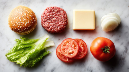 Vibrant and fresh ingredients arranged for a homemade burger, featuring a sesame bun, juicy beef patty, cheese, crisp lettuce, fresh tomatoes, and onion slices on a marble background.の素材