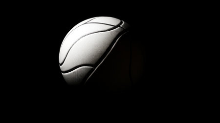 This image features a sleek basketball against a black background, highlighting its unique texture and design. Ideal for sports, fitness, and athletic-themed projects.の素材