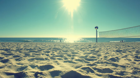 A stunning beach scene showcasing a volleyball net, golden sand, and sparkling ocean waves under the bright sun, perfect for leisure activities and vibrant summer fun.の素材