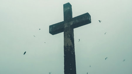 Captivating image of a tall wooden cross shrouded in fog, surrounded by flying birds, inspiring feelings of faith, contemplation, and connection with nature.の素材