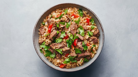 Enjoy a hearty beef stir-fry mixed with fluffy rice, colorful veggies, and aromatic herbs, offering a delightful and nutritious meal option for any occasion.の素材