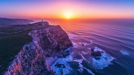 A stunning view of a sunset illuminating a rugged coastline with a lighthouse, capturing the beauty of nature, tranquility, and vibrant colors over the serene ocean waters.の素材